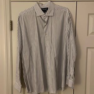 Polo Golf.  100% cotton.  XL.  White with black and purple stripping.